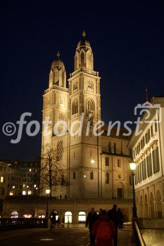 Zürich, Grossmünsterkirche an der Limmat nachts hell beleuchtet, Switzerland, Zürich by night. Grossminster-church at the Limmat river in the old part of the town. 
