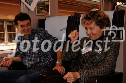 Bundesrätin und Justizministerin Eveline Widmer-Schlumpf mit ihrem Ehemann im RhB-Zug auf der Fahrt zur 100 Jahre Bernina-Bahn Feier. Swiss Chancellor and Minister of Justice Eveline Widmer-Schlumpf with her husband in the train