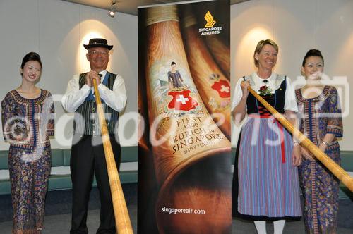 Die A-380 Inaugurationsfeier am Zürcher Flughafen mit Alphornbläsern. A-380 First Flight ceremony at Zürich Airport with swiss alphorns and asian stewardess