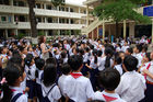 Vietnamese school in Nha Trang with hundrets of school-kids. Vietnamesische Schule mit Pausenhof voller Schüler