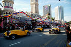 50 Jahre Merdeka Unabhängeits-Parade am 31. August 2007 in K uala Lumpur mit zahlreichen ausländischen Staatsgästen, vielen Staatschefs und Regierungspräsidenten aller asiatischen Länder sowie Abgesandte, Diplomaten von den USA, von UK Britischem Königreich. Veteranen-Parade mit Oldtimer-Mobilen fahren vor.
Kolonialismus, Unabhängigkeit, Islam, Staatsreligion. Medienspektakel, Journalisten, 
Sicherheitsleute, Beamte, Regierung, Besucher, Militärparade, Islam, Staatsreligion,
mit zahlreichen asiatische Länder-Staatschefs und Regierungspräsenten zu Gast 

Veteran-Parade with oldtimer  in front of the tribune with all the asian premier-ministers and diplomats from all over the world. at the 50 Years Merdeka-Parade in Kuala Lupur at 31st of august 2007. Celebration of 50 years nation-building and freedom from the british empire colonialism in a malay-muslim, chinese, indian mixed society. The Tribune in front of the parliament house with the invited asian presidents and representatives, diplomats from UK and USA as well as from many more countres. Mediaspectakel with thousands of journalist, TV-Stations and media-representatives around the world covering this big malaysian event of history
