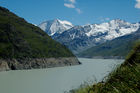 Das Schmelzwasser von 35 Gletschern wird in der weltweit grössten Gewichtsstaumauer Grande Dixence im Wallis gespeichert und zu Strom für 400'000 Haushalte pro Jahr verarbeitet. Die 285 Meter hohe und an der Krone 700 Meter lange sowie am Sockel 200 Meter breite Staumauer vermag dem Druck von 400 Mio. m3 zu wiederstehen. Das Bauwerk
ist 15 Mio. Tonnen schwer, 6 Mio. Tonnen Beton wurden für den Bau verwendet. 

The melting water of 35 glaciers are brought and pumped to the Lake Dixence, where the 
world biggest wall is producing electricity  for 400’000 houses throughout the year. The 
wall is 285 meters high, on top 700 Meters wide and on the bottom 200 Meters thick. 
The wall can resist the presure of 400 Mio. m3 Water and is made out of 6 Mio. tons
of beton and the total weight of the wall is 15 Mio. tons. 
