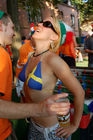 Having fun: Swedish footballfan girl with dutch footballfans in Basel. Eine schwedische Fussballbraut und holländische Fans amüsieren sich köstlich in der Fanzone von Basel