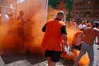 Holländische Fussballfans zünden eine Oranje-Raubombe auf dem BAsler MArktplatz. Dutch Firework from the footballfans coming to Basel for the last Euro 2008 Game. Holländisches Feuerwerk und Oranje-Rauchbombe in Basel auf dem MArktplatz, Hooligans, 