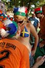 Having fun: Swedish footballfan girl with dutch footballfans in Basel. Eine schwedische Fussballbraut und holländische Fans amüsieren sich köstlich in der Fanzone von Basel