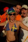 Having fun: Swedish footballfan girl with dutch footballfans in Basel. Eine schwedische Fussballbraut und holländische Fans amüsieren sich köstlich in der Fanzone von Basel