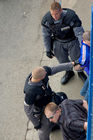 Die Delta-Security-guards verhaften einen Hooligan, nachdem Spotter ihn in der Fussballarena und Public viewing Zone von Zürich gesichtet haben. The Swiss police has everything under controll so far. A tremendous amount of security forces are all around the public viewing areas. Here the Delta-security-forces are capturing a hooligan. 