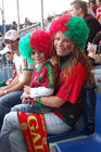 Portugisische Fussball-Fan-Mutter mit Kind auf der Tribune der Public viewing Arena in Zürich beim Match gegen die Tschechen. Portugal-footballfans celebrating the victory of their team against the Tschech Team