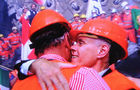 Freude herscht: Adolf Ogi und Bundesrat Moritz Leuenberger sind gerührt, fallen sich in die Arme und kriegen feuchte Augen beim Gotthard-Tunnel-Durchstich. Huging Adolf Ogi and swiss chancellor Moritz Leuenberger at the break through in the worlds longest tunnel the Gotthard (57 km)