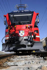 100 Jahr Feier Bernina Bahn: Einer der soeben neunen Triebwagen (Lokomotiven) der Rhätischen Bahn auf dem Hospitz. 100 years swiss alp transit train Bernina-Express with oneof the seven new locomotives 