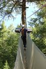 Abenteuer-Parcours im Walliser Wald bei Vercorin mit Hängebrücken und Seilwinden über 100 Meter. Adventure-Park for kids and adults in the forest near Vercorin in the Valley of 