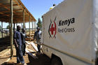One of 10 Kenya Red Cross timber sites for reconstruction Kenyan farmhouses. Zwei Rot-Kreuz Fahrzeuge fahren zur einer von zehn Rot Kreuz Holzwerkstätten für den Wiederaufbau der Bauernhäuser