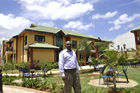 Dr. James Kisia, Kenya Red Cross deputy secretary general  in front of the only Red Cross Hotel in the world, which is in Nairobi. Kenya Red CrossVizegeneralsekretär Dr. James Kisia vor dem weltweit einzigen Rot-Kreuz-Hotel in Nairobi