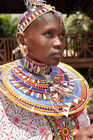 Beautifull Masai Women with tradition colour glass perls around her neck. Hübsche Masai-Frau mit traditionellem Glasperlenschmuck, Halsringe