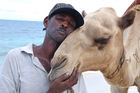 Kenyians are waiting for more tourists - not only for riding a camel at Mombasa Beach. Die Kenyaner in Mombasa warten sehnsüchtig auf die Rückkehr der Touristen