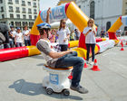 (C) fotodienst.at /Anna Rauchenberger  - Wien, 27.05.2011 –  Chronisch entzündliche Darmerkrankungen (CED) bedeuten für die Betroffenen neben dem chronischen Durchfall oft andauernde Schmerzen, Blutungen, Appetitlosigkeit, Müdigkeit und eine Vielzahl an Begleiterkrankungen der Gelenke, Haut und Augen. Gezielte Aktionen, wie der Toilet Race am Wiener Michaelerplatz, sollen die Bevölkerung auf chronisch entzündliche Darmerkrankungen aufmerksam machen und darüber aufklären. FOTO: der letzte Fahrer des Siegerteams  des Toilet Race fährt ins Ziel ein